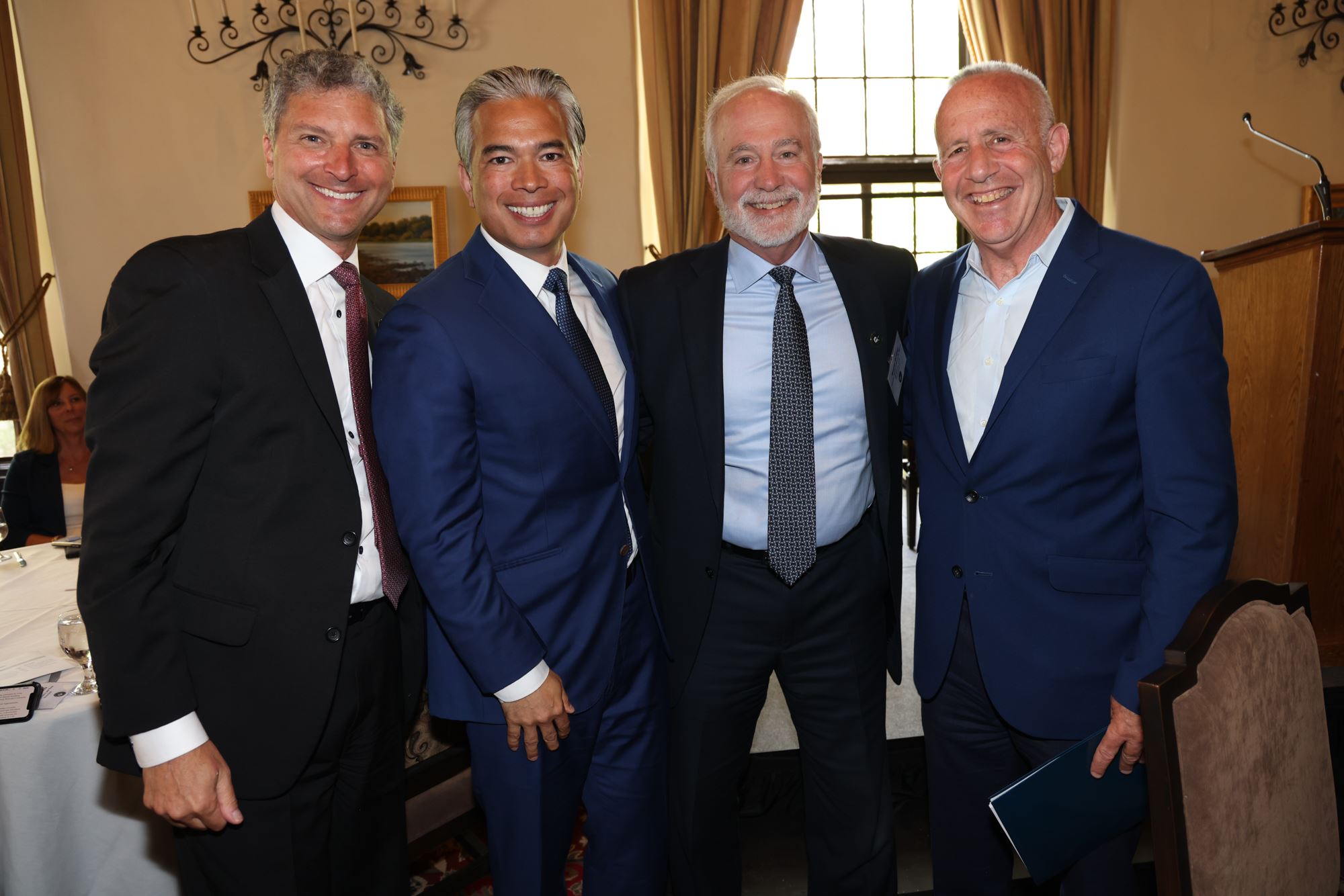 group of people in suits talking